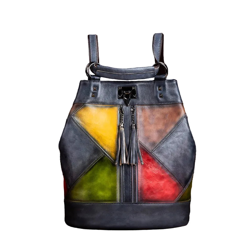 Multicolored patchwork bag with tassels on a brown textured background